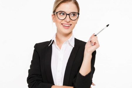 Happy blonde business woman in eyeglasses with pen in hand having idea and looking away over white background